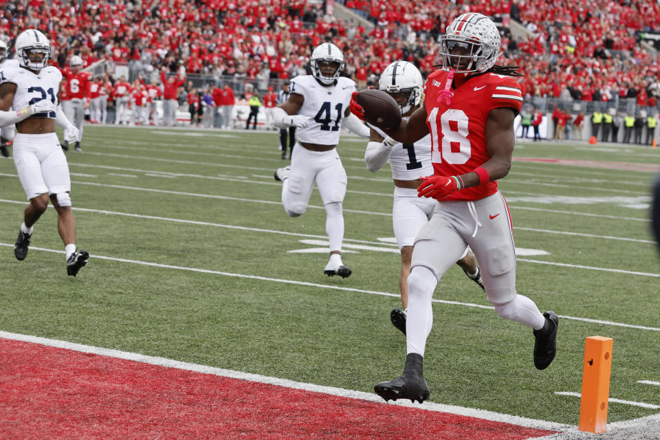 Ohio State receiver Marvin Harrison scores a touchdown against Penn State during the second half on Saturday. (AP Photo/Jay LaPrete)