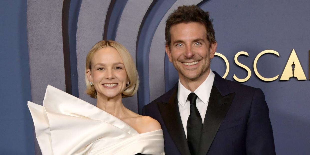 carey mulligan on the red carpet with bradley cooper