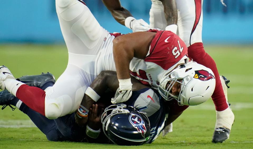 Tennessee Titans quarterback Malik Willis (7) gets tackled by <a class="link " href="https://sports.yahoo.com/nfl/teams/arizona/" data-i13n="sec:content-canvas;subsec:anchor_text;elm:context_link" data-ylk="slk:Arizona Cardinals;sec:content-canvas;subsec:anchor_text;elm:context_link;itc:0">Arizona Cardinals</a> defensive tackle Manny Jones (75) during the second quarter of an NFL preseason game at Nissan Stadium Saturday, Aug. 27, 2022, in Nashville, Tenn.<br>Syndication <a class="link " href="https://sports.yahoo.com/nfl/teams/arizona/" data-i13n="sec:content-canvas;subsec:anchor_text;elm:context_link" data-ylk="slk:Arizona;sec:content-canvas;subsec:anchor_text;elm:context_link;itc:0">Arizona</a> Republic