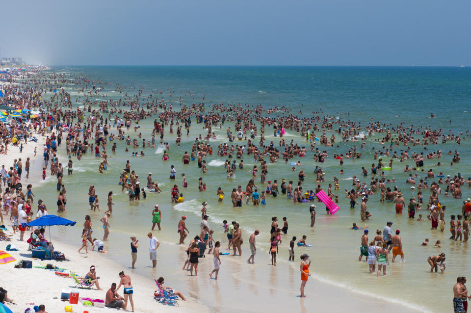 Many people at a crowded beach.