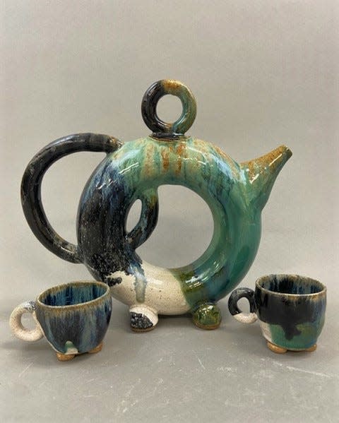 Artist Lydia Royce's work includes wheel thrown ceramic vessels including vases and pitchers, many in unusual shapes. Royce is the featured artist at Downtown Art Gallery in Titusville for the month of August, 2023.