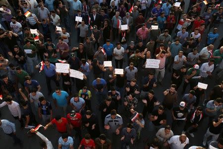 People gather during a protest in Kerbala, Iraq July 20, 2018. REUTERS/Abdullah Dhiaa al-Deen