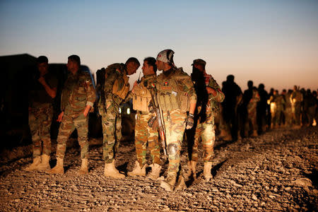 Peshmerga forces gather in the east of Mosul to attack Islamic State militants in Mosul, Iraq. REUTERS/Azad Lashkari