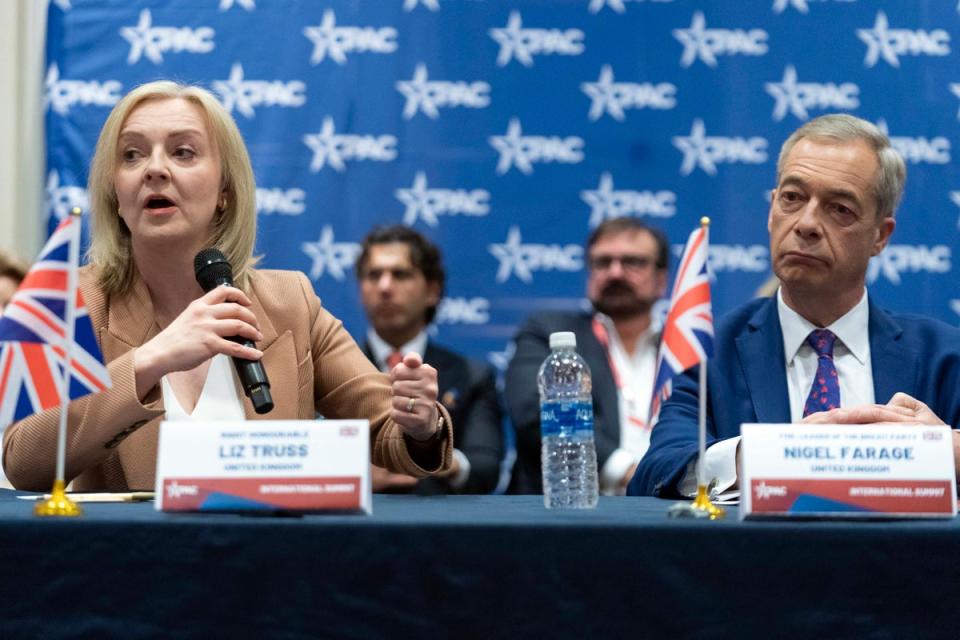 Former UK prime minister Liz Truss and ex-Brexit Party leader Nigel Farage at CPAC in Washington DC (AP)