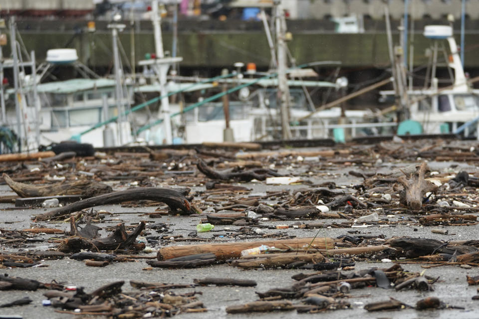 Sea wracks land at a port as Typhoon Hagibis approaches in town of Kiho, Mie prefecture, central Japan Saturday, Oct. 12, 2019. Tokyo and surrounding areas braced for a powerful typhoon forecast as the worst in six decades, with streets and trains stations unusually quiet Saturday as rain poured over the city. (AP Photo/Toru Hanai)