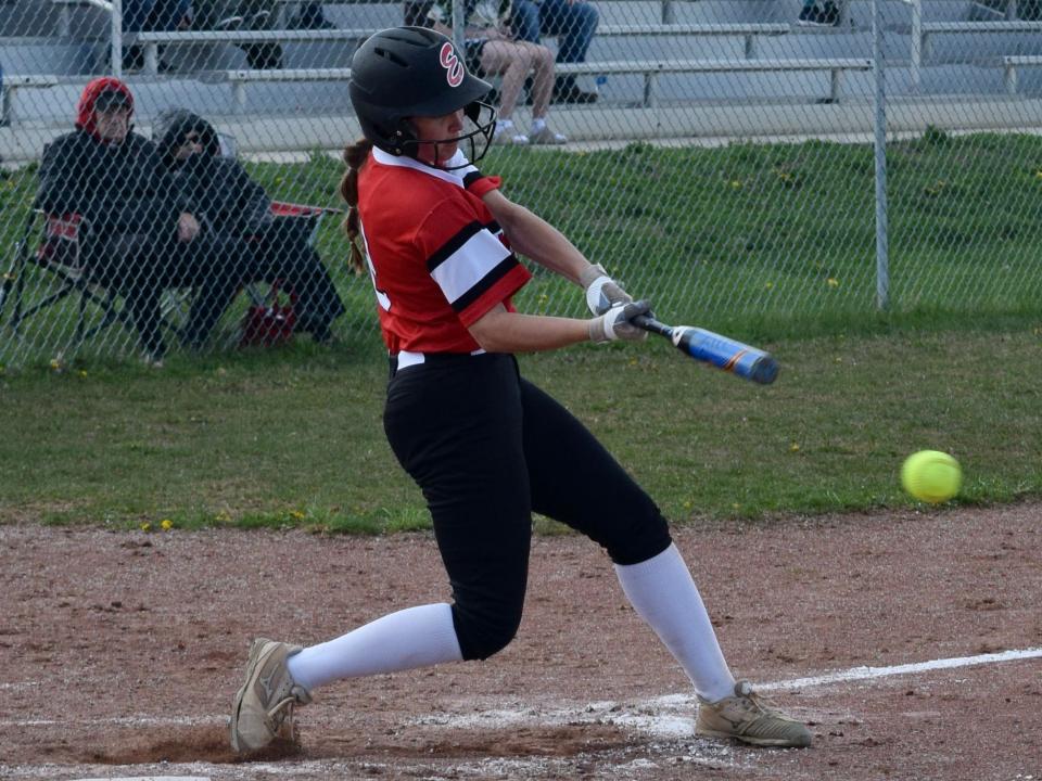 Edgewood senior Alaina Winzeler hits a ground ball during the Mustangs' win over Indian Creek Thursday. (Seth Tow/Herald-Times)