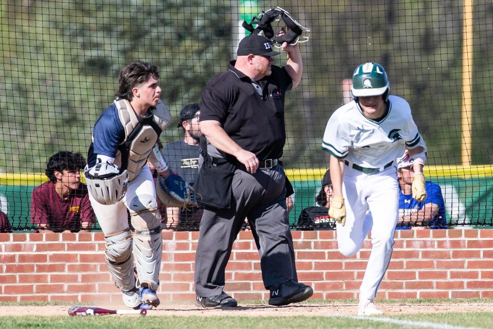 Saint MarkÕs High School's Brad Marks runs for first base after hitting the ball against Salesianum School during the baseball game at Saint MarkÕs in Milltown, Wednesday, April 12, 2023. St. MarkÕs won 4-3.