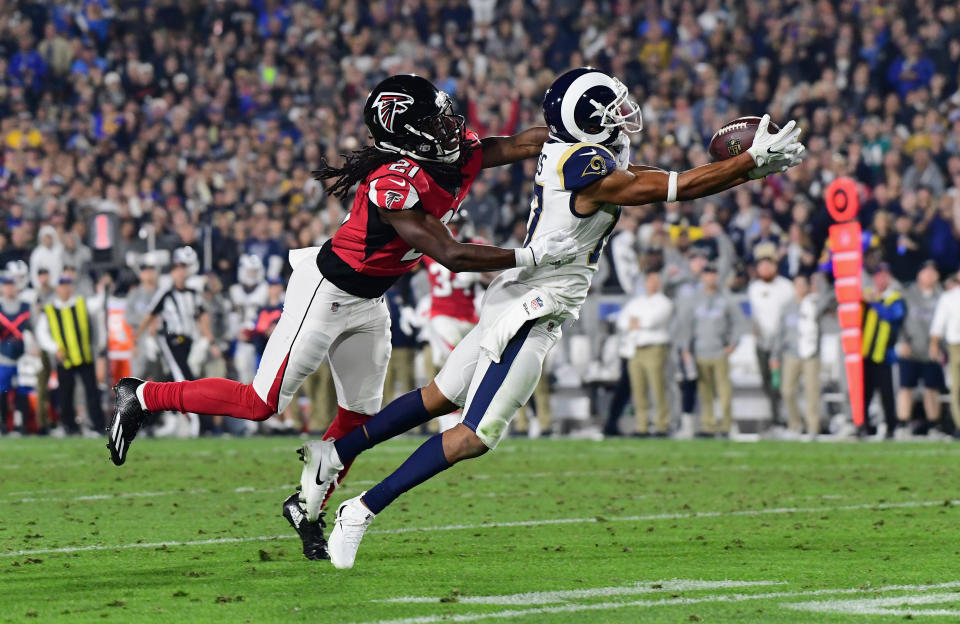 <p>Wide receiver Robert Woods #17 of the Los Angeles Rams makes a catch in front of cornerback Desmond Trufant #21 of the Atlanta Falcons during the second quarter of the NFC Wild Card Playoff game at Los Angeles Coliseum on January 6, 2018 in Los Angeles, California. (Photo by Harry How/Getty Images) </p>