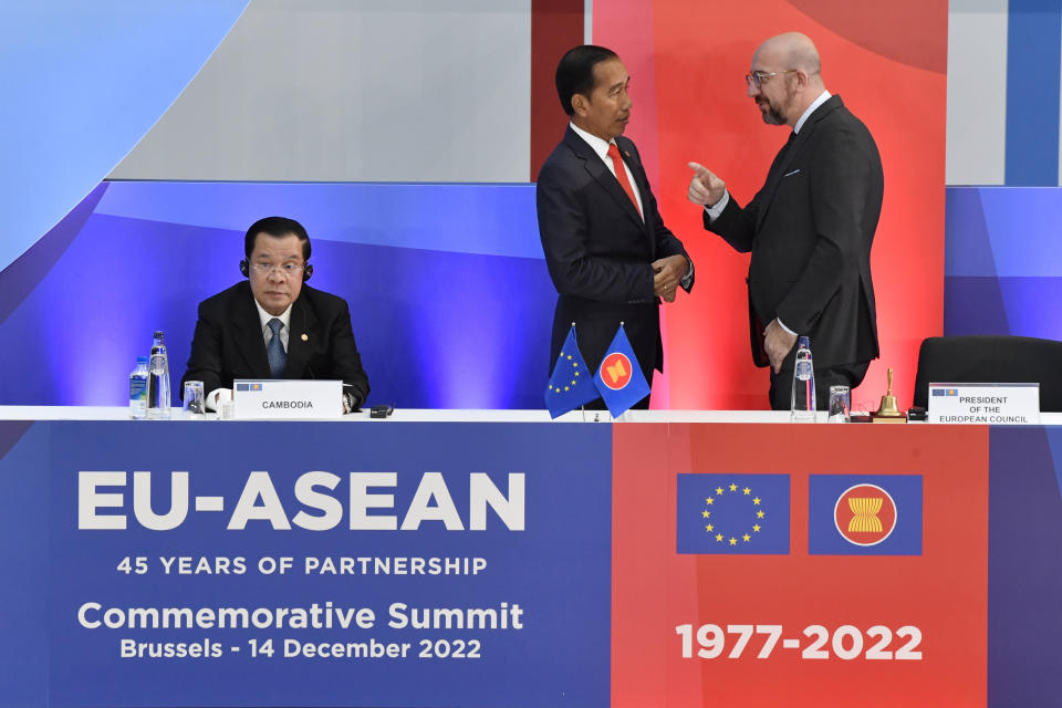 European Council President Charles Michel, right, speaks with ndonesia's President Joko Widodo, center, during the opening ceremony at an EU-ASEAN summit in Brussels, Wednesday, Dec. 14, 2022. EU and ASEAN leaders meet in Brussels for a one day summit to discuss the EU-ASEAN strategic partnership, trade relations and various international topics. (AP Photo/Geert Vanden Wijngaert)
