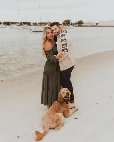 <p>Summer Simmons Photo + Films</p> Baker Mayfield and wife Emily with ultrasound photos