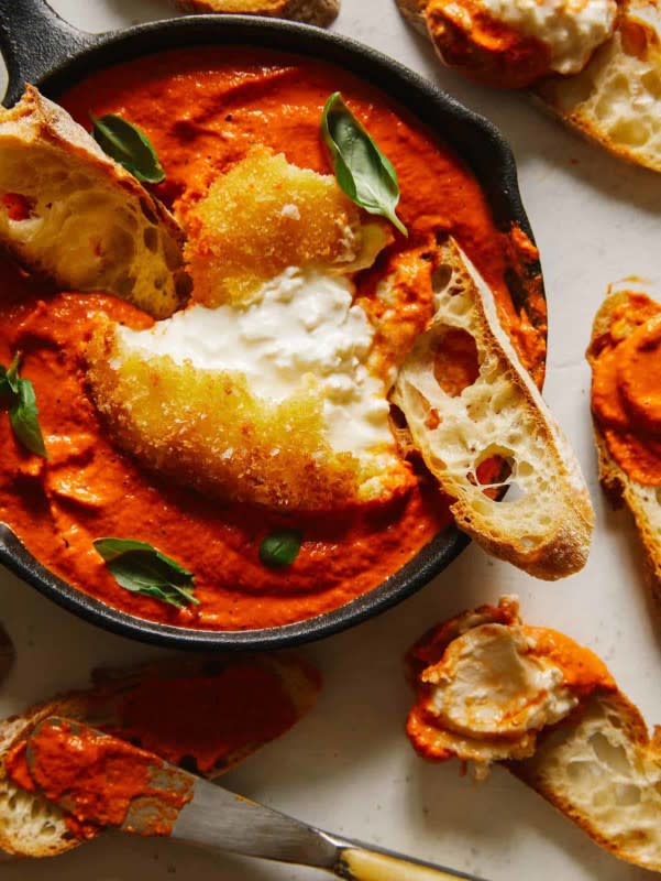 <p>Spoon Fork Bacon</p><p>This fried burrata is delicious and together with the romesco this is a next level appetizer.</p><p><strong>Get the recipe: <a href="https://www.spoonforkbacon.com/fried-burrata-over-romesco-sauce/" rel="nofollow noopener" target="_blank" data-ylk="slk:Fried Burrata Over Romesco Sauce;elm:context_link;itc:0;sec:content-canvas" class="link rapid-noclick-resp"><em>Fried Burrata Over Romesco Sauce</em></a></strong></p>