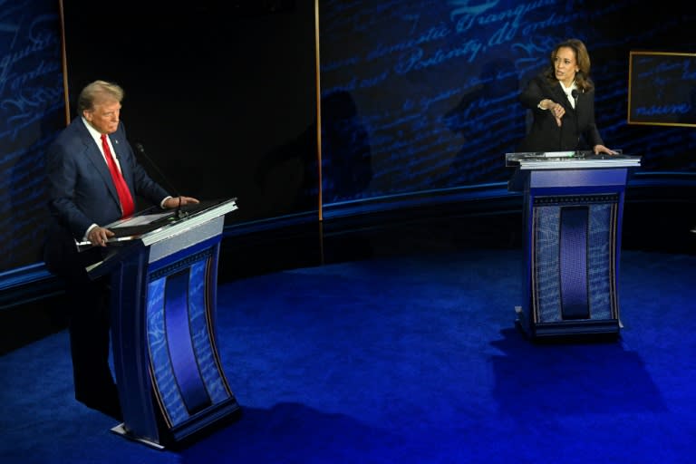 US vice president and Democratic presidential candidate Kamala Harris gives a thumbs down as former US president and Republican presidential candidate Donald Trump gestures during their debate in Philadelphia (SAUL LOEB)