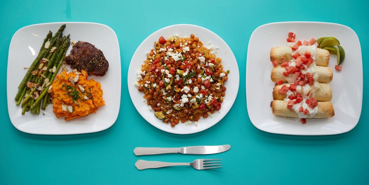 prepared dishes on a blue background for good housekeeping best meal delivery services testing