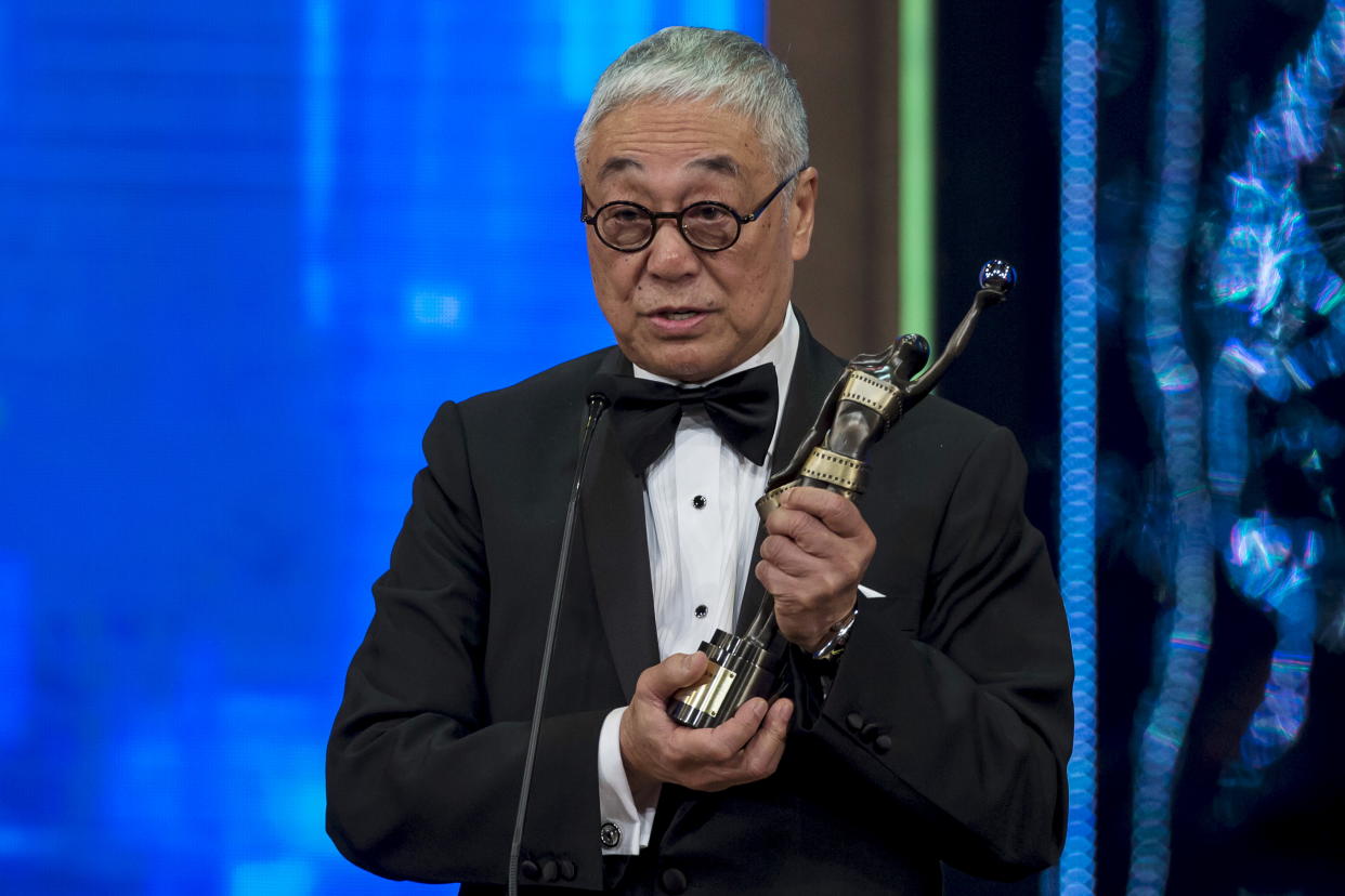 Hong Kong actor Kenneth Tsang celebrates after winning the Best Supporting Actor award for his movie 