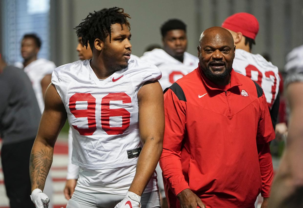 Mar 7, 2024; Columbus, OH, USA; Ohio State Buckeyes defensive end Eddrick Houston (96) works with defensive line coach Larry Johnson during spring football practice at the Woody Hayes Athletic Center.