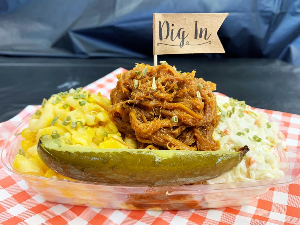 Three scoops -- pulled pork, macaroni and cheese and coleslaw, plus a pickle on the side makes up the Pork BBQ Split at the 2019 Indiana State Fair.