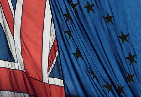 FILE PHOTO: A Union flag flies next to the flag of the European Union in London, Britain, January 24, 2017. REUTERS/Toby Melville/File Photo