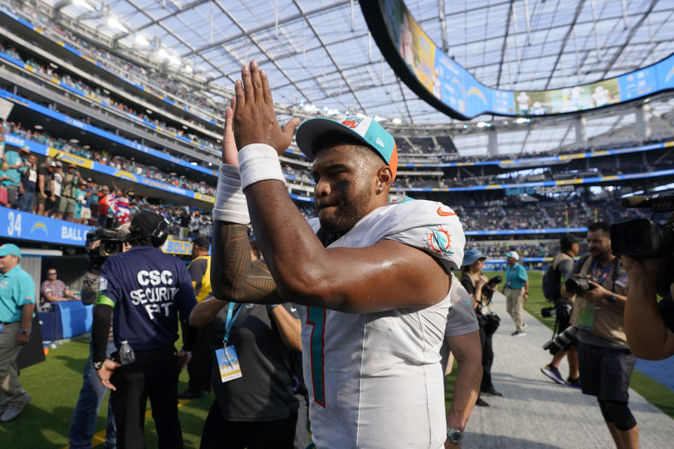 Miami Dolphins quarterback Tua Tagovailoa walks off the field after a 36-34 win over the Los Angeles Chargers in an NFL football game Sunday, Sept. 10, 2023, in Inglewood, Calif. (AP Photo/Mark J. Terrill)