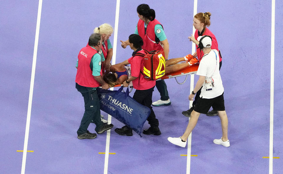 Alessia Zarbo, pictured here being taken off the track on a stretcher.