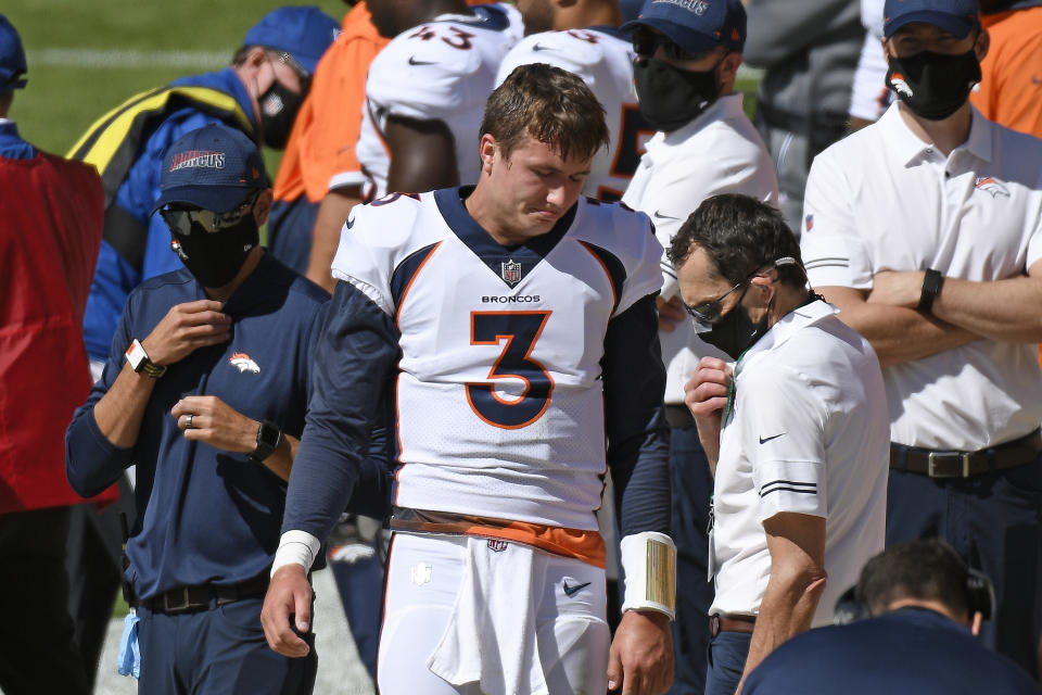 Denver Broncos quarterback Drew Lock (3) stands on the sideline after being injured during the first half of an NFL football game against the Pittsburgh Steelers in Pittsburgh, Sunday, Sept. 20, 2020. (AP Photo/Don Wright)