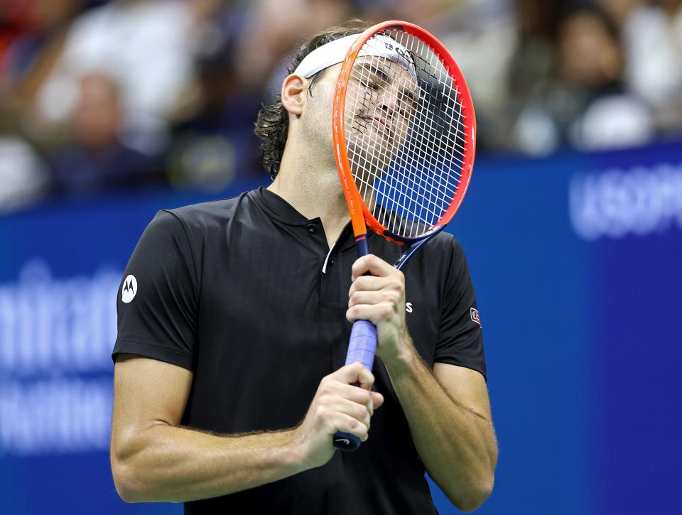 A disappointed Taylor Fritz of the United States reacts after missing a shot against Tiafoe (Getty Images)