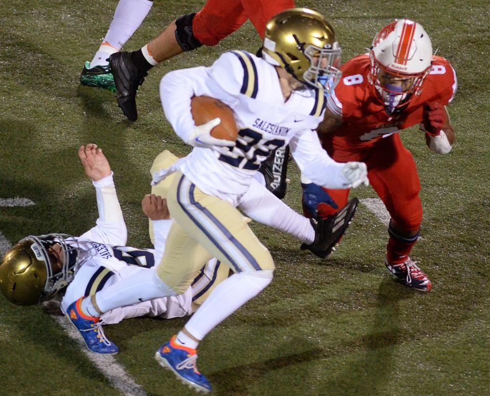 Salesianum's Jacob Ziegler carries for some yardage in game with Smyrna.