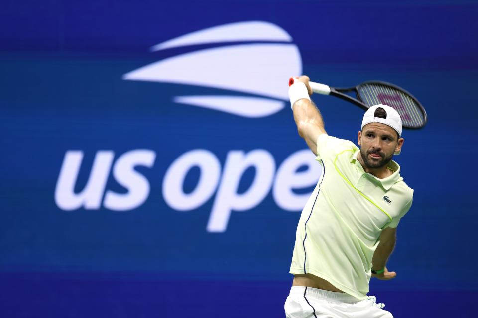 NEW YORK, NEW YORK - SEPTEMBER 03: Grigor Dimitrov of Bulgaria returns a shot against Frances Tiafoe of the United States during their Men's Singles Quarterfinal match on Day Nine of the 2024 US Open at USTA Billie Jean King National Tennis Center on September 03, 2024 in the Flushing neighborhood of the Queens borough of New York City. (Photo by Jamie Squire/Getty Images) (Getty Images)