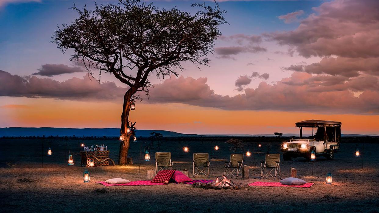 a traditional safari sundowner in mahali mzuri luxury camp