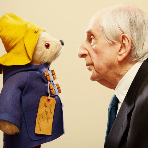 Michael Bond with his beloved furry creation - Credit: Getty