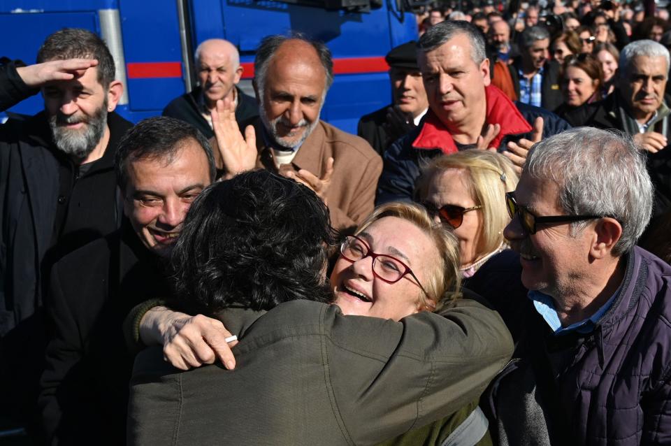 Members and spokeswoman Mucella Yapici (C) of the Taksim Solidarity Platform celebrates outside the Silivri Prison and Courthouse complex in Silivri, near Istanbul on Tuesday: AFP via Getty Images