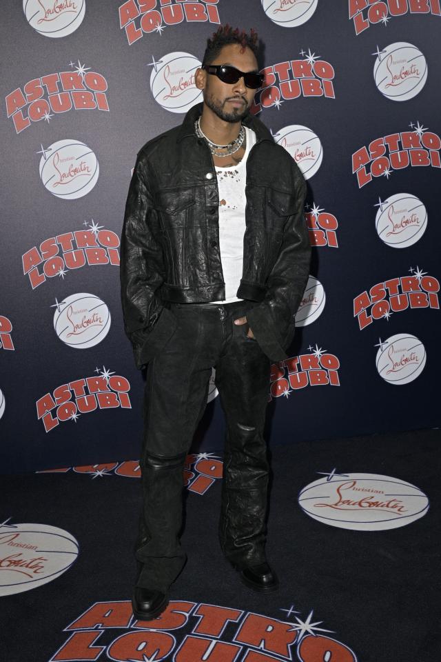 Miguel Buckles into Spiked Combat Boots at Christian Louboutin's