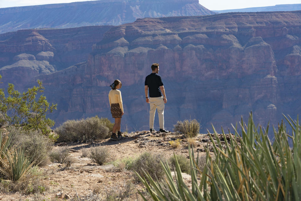 This image released by Prime shows Oliver Jackson-Cohen as Will Taylor, right, and Jenna Coleman as Liv Taylor in a scene from "Wilderness." (Stefania Rosini/Prime via AP)