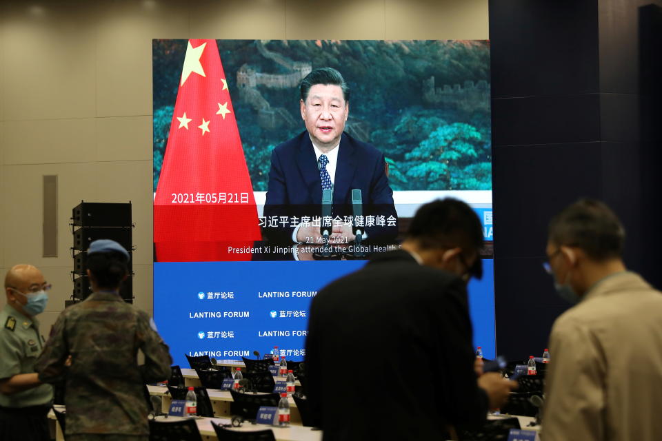 A screen shows footages of Chinese President Xi Jinping before the Lanting Forum with the theme 