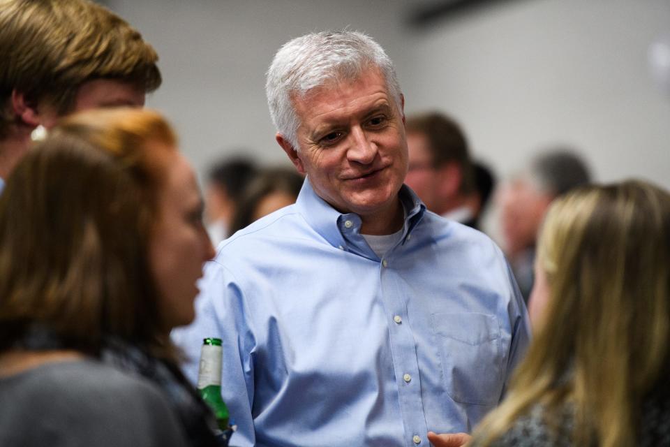 State Rep. Jason Elliot, who is running for reelection in district 22, speaks with members of the public during an election watch party at Swamp Rabbit CrossFit on Tuesday, Nov 6, 2018.