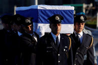 <p>The flag-draped coffin of former Israeli President Shimon Peres is carried by members of a Knesset guard upon its arrival at the Knesset Plaza, is Jerusalem on Sept. 29, 2016. (REUTERS/Ronen Zvulun) </p>