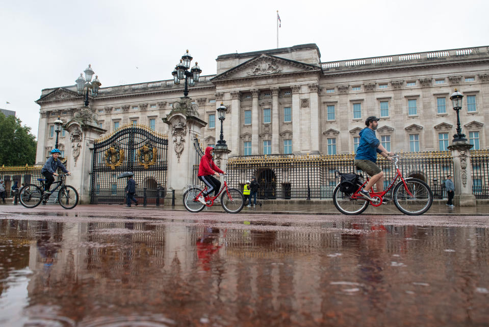 A cycle tour group ride in the rain outside Buckingham Palace, London, as many parts of the UK experience wet weather ahead of the arrival of Storm Ellen, which is forecast to bring strong winds. (Photo by Dominic Lipinski/PA Images via Getty Images)