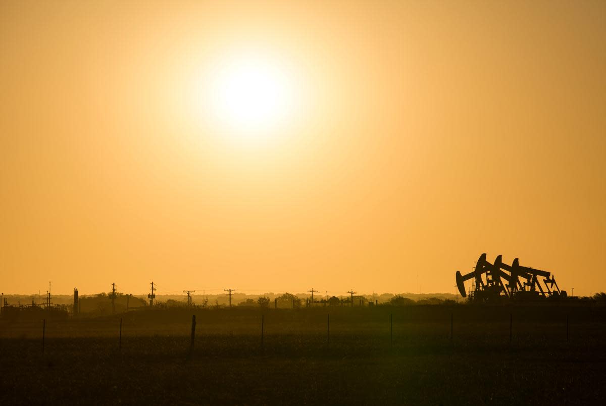 An array of pumpjacks operate along Texas State Highway 80 Thursday, Aug. 17, 2023 in Karnes County.