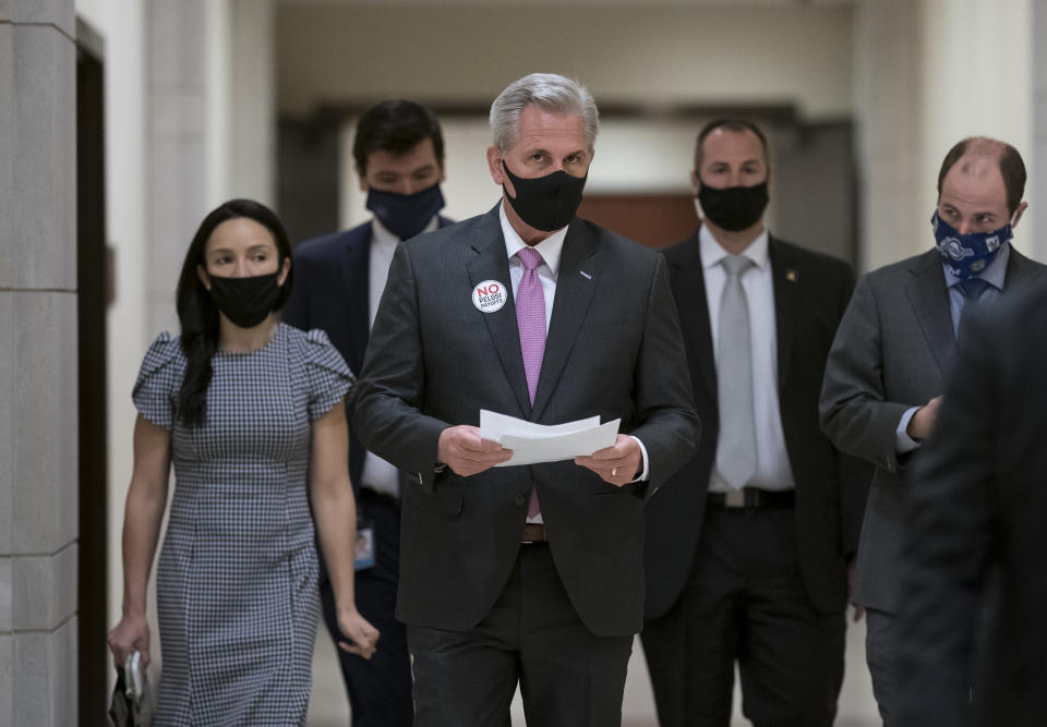 House Minority Leader Kevin McCarthy, R-Calif., arrives for a news conference where he criticized Speaker of the House Nancy Pelosi, D-Calif., and the Democratic $1.9 trillion COVID relief package, during a news conference at the Capitol in Washington, Friday, Feb. 26, 2021. (AP Photo/J. Scott Applewhite)