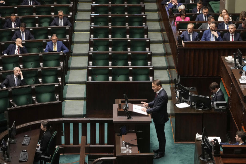 Poland's Foreign Minister Radek Sikorski delivers a speech to the parliament in Warsaw, Poland, on Thursday April 25, 2024. Sikorski told the parliament that the government wants to return to the group of countries which sets the agenda of the European Union. (AP Photo/Czarek Sokolowski)