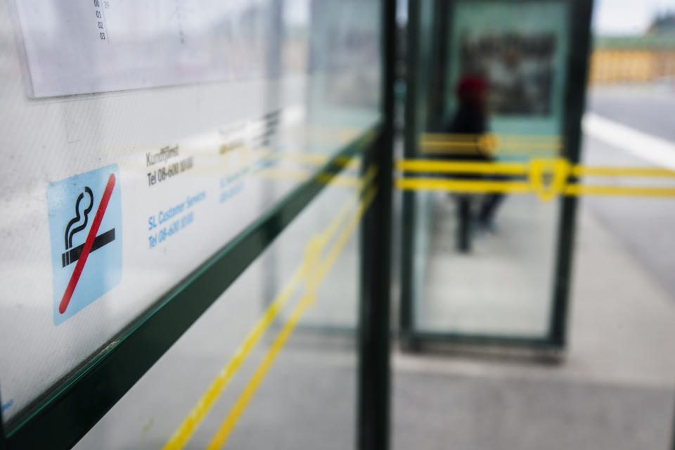 FILE - A no smoking sign is seen at a bus stop in Stockholm, Sweden, June 25, 2019. Sweden, which has the lowest rate of smoking in Europe is now close to declaring itself “smoke free,” defined as having less than 5% daily smokers in the population. Some experts give credit to decades of anti-smoking campaigns and legislation, while others point to the prevalence of “snus,” a smokeless tobacco product that’s illegal elsewhere in the European Union but is marketed in Sweden as an alternative to cigarettes. (Magnus Andersson /TT News Agency via AP, File)