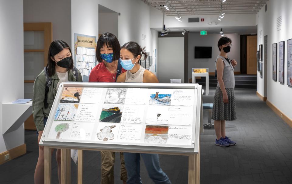 Communities in Conversation: Cultural Asset Mapping in Sheboygan installation view at the John Michael Kohler Arts Center, 2021. Angie Gao, left, Shihong Nicolaou, Giorgia Nicolaou and Damchen Gao, far right background.