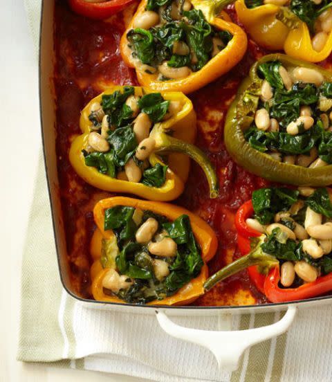 <p>Stuffed peppers are a great dish for the holidays (or any time of year honestly). All you have to do is fill a few bell peppers with whatever your little heart desires and cook them. These are stuffed with spinach, white beans, mozzarella, and parmesan cheese. </p><p><em>Get the <a href="https://www.womansday.com/food-recipes/food-drinks/recipes/a11842/cheesy-stuffed-peppers-with-white-beans-recipe/" rel="nofollow noopener" target="_blank" data-ylk="slk:Cheesy Stuffed Peppers with White Beans recipe;elm:context_link;itc:0;sec:content-canvas" class="link ">Cheesy Stuffed Peppers with White Beans recipe</a>.</em></p>