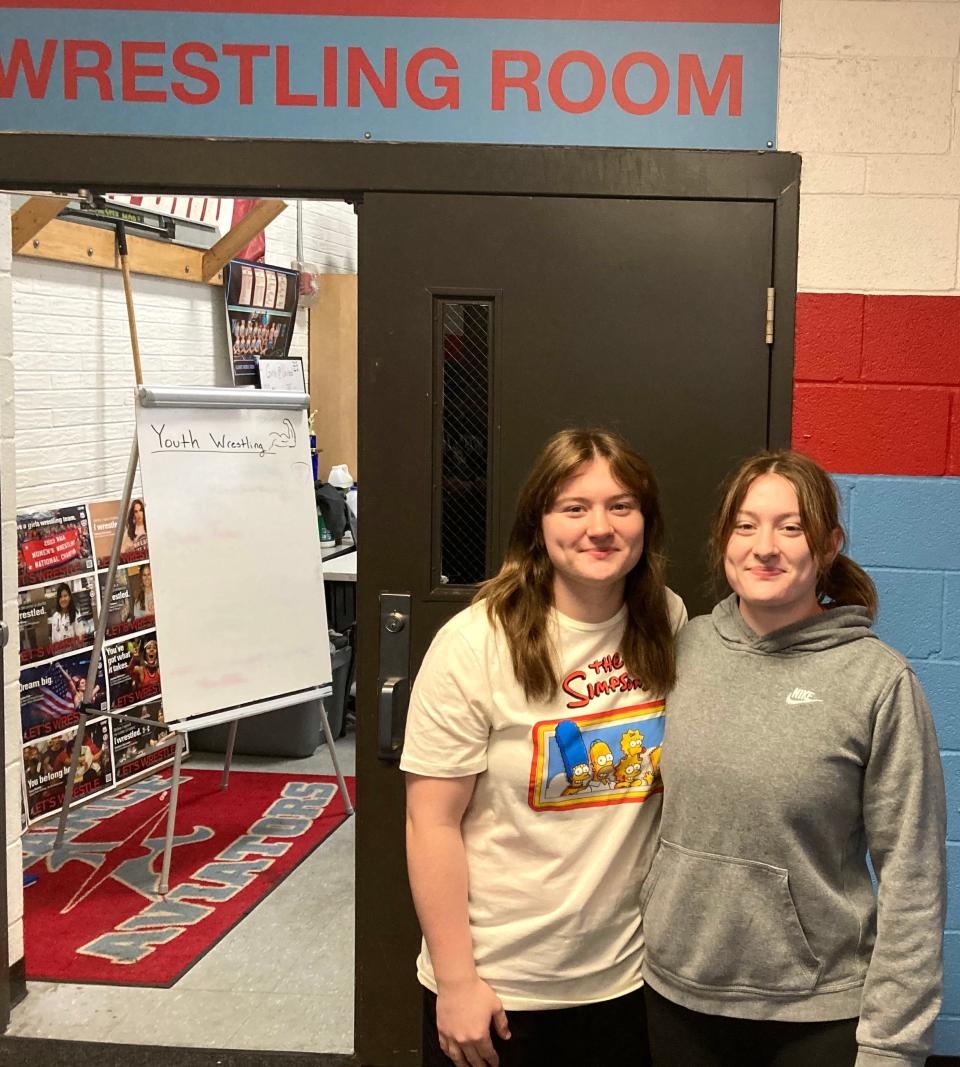 Twin sisters Adilyn, left, and Abigail Mozden of Alliance will hit the mats this winter.