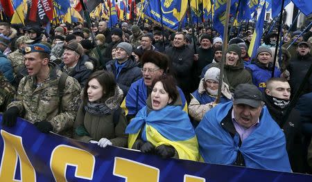 Activists of nationalist groups and their supporters take part in the so-called March of Dignity, marking the third anniversary of the 2014 Ukrainian pro-European Union (EU) mass protests, in Kiev, Ukraine, February 22, 2017. REUTERS/Valentyn Ogirenko