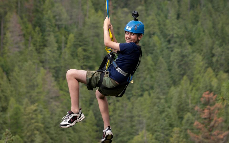 Charlie riding the Kokanee Mountain Zipline