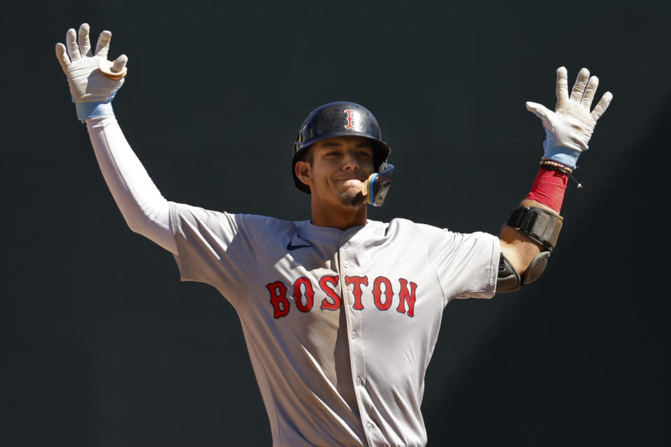 Boston Red Sox's Vaughn Grissom celebrates after his two-run double against the Minnesota Twins in the eighth inning of a baseball game Sunday, May 5, 2024, in Minneapolis. (AP Photo/Bruce Kluckhohn)