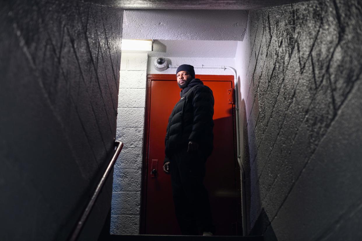 Taronn Sloane, 36, in the staircase of his building at the Tilden Houses in Brooklyn, New York.