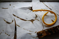 <p>A newly bent section of neon tube is placed against the original design drawings in God’s Own Junkyard workshop in Rainham, east London, Britain, May 17, 2017. (Photo: Russell Boyce/Reuters) </p>