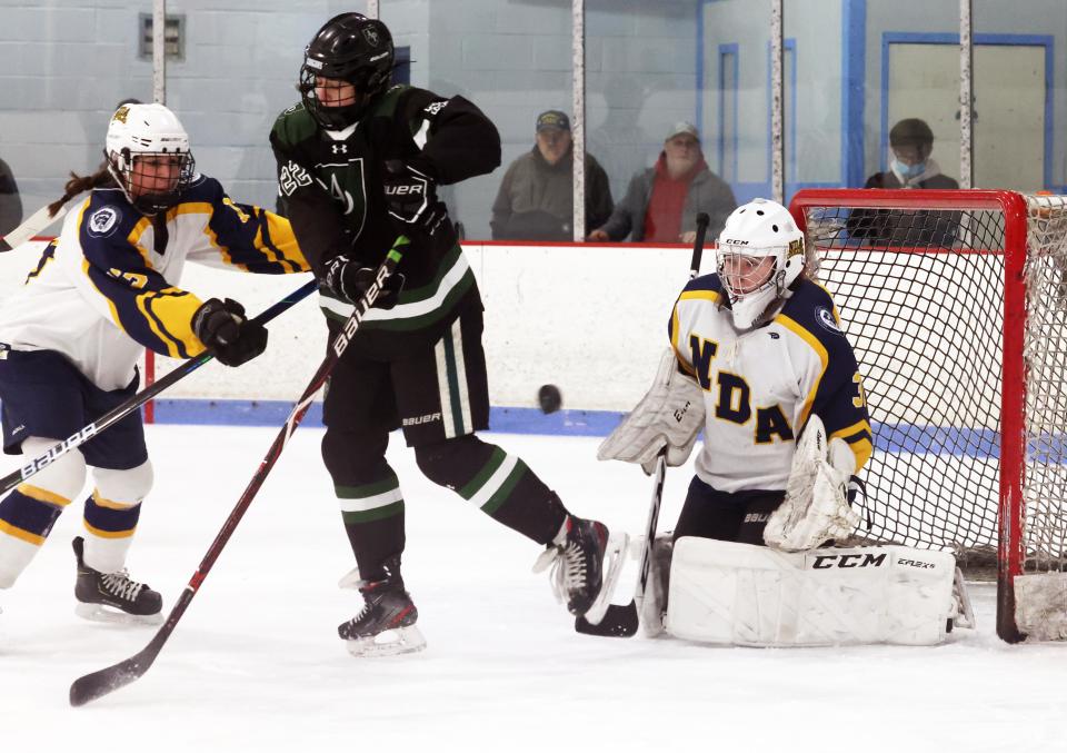 Notre Dame Academy goalie Lily Prendergast tracks the puck during a game against  Austin Prep at the Rockland Ice Rink on Saturday, Jan. 22, 2022.