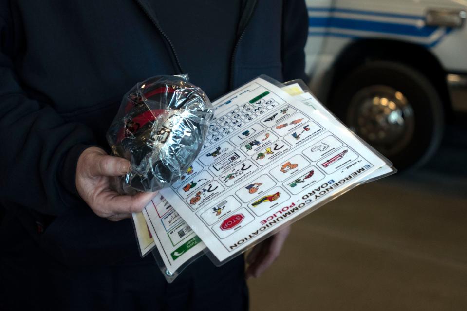 Horsham Fire Co. Lt. Brian Focht holds the sensory kit created and sent to local fire stations to use when communicating with individuals who are on the autism spectrum, at Horsham Fire Company station on Meetinghouse Road on Wednesday, Feb. 16, 2022. Having a son with autism inspires and informs Focht's work at the fire company.